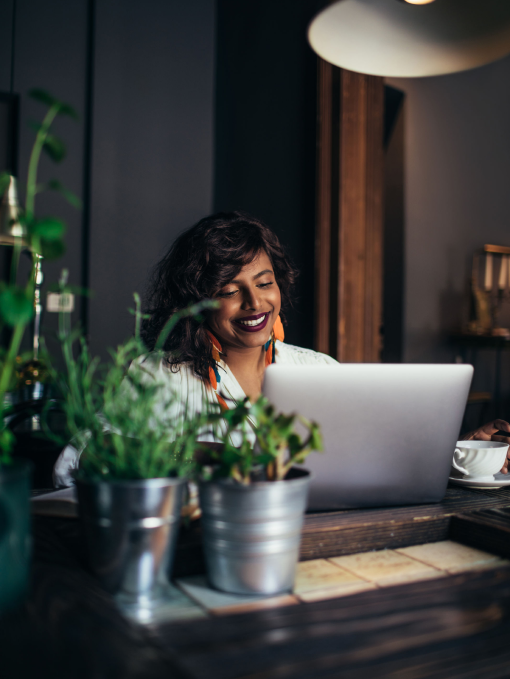 Smiling lady using laptop